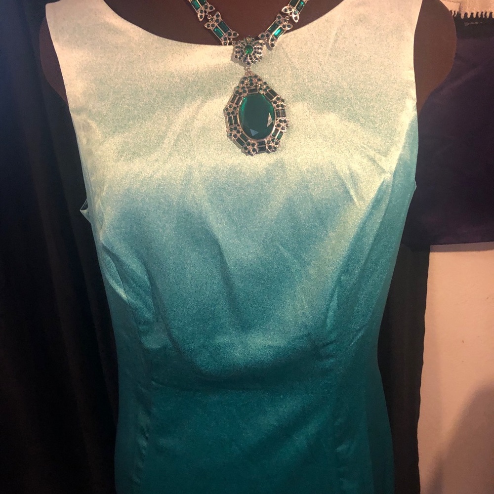 Green sheath dress.